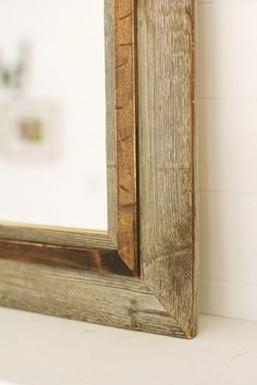 a wooden frame sitting on top of a white counter