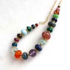 Gorgeous gemstones in every hue, this multi gemstone necklace features AAA gemstones in a variety of polished stones. The piece which is 18 inches in length and secures with a toggle clasp. A one and only. Additional length can be added, or removed, please inquire. Multicolor Single Strand Gemstones As A Gift, Spiritual Multicolor Gemstones With Accents, Spiritual Multicolor Necklace With Gemstone Accents, Multicolor Spiritual Necklaces With Gemstone Accents, Multicolor Spiritual Gemstones With Accents, Multicolor Rondelle Natural Gemstones, Multicolor Natural Rondelle Gemstones, Rondelle Multicolor Natural Gemstones, Multicolor Gemstone Beads Multi-strand Necklace