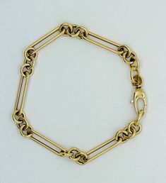 14kt Italian Yellow Gold  Long Paperclip & Round Link Chain Bracelet ❤ 14kt yellow gold ❤ Long Link Size: 20 x 4mm ❤ Round Link Size: 5mm ❤ Lock : Lobster ❤Lock  size: 14 x 6mm ❤ Length : 7  (6 grams)  ❤Made in Italy ❤The bracelet has a matching necklace 14k Gold Oval Link Jewelry With Box Clasp, Yellow Gold Link Jewelry, Classic Jewelry With Rectangular Links And Gold Clasp, Classic Jewelry With Gold Clasp And Rectangular Links, Classic Jewelry With Gold Clasp Oval Link, 14k Gold Oval Link Jewelry With Gold Clasp, Yellow Gold Chain Bracelet With Box Clasp, Vintage Yellow Gold Bracelet With Rectangular Links, Luxury 14k Gold Bracelet With Lobster Clasp