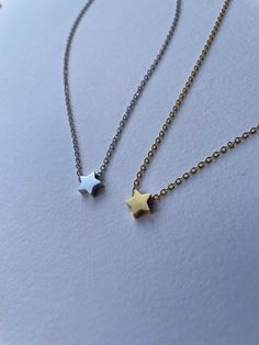 Meaning: No matter what you go through, your shine will never dull. Cute 3D star necklace perfect for everyday wear. All items are handmade and a portion of the profits will go to MIND charity, supporting mental health. This star pendant is rhodium or gold plated stainless steel making it durable and long lasting, supported on a silver or gold plated brass chain that is lightweight and comfortable. Minimalist Star Charm Necklace As Gift, Minimalist Star Charm Necklace For Gift, Simple Star Charm Jewelry Gift, Minimalist Handmade Star Necklaces, Handmade Minimalist Star Necklace, Minimalist Star Necklace For Everyday, Minimalist Handmade Star Necklace, Dainty Star-shaped Necklace For Gift, Dainty Star Necklace For Gift