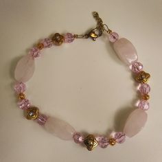 Rose Quartz And Pink Crystal With Gold Tone Bead Accents With Tiny Crystals In Them. Unbranded, Handmade, Vintage And In New Condition Never Worn Except For Photos. 9 Inches Long And Could Adjust A Little With The Chain On The End. Elegant Rose Quartz Pink Crystal Bracelet, Handmade Pink Crystal Elegant Bracelet, Pink Rose Quartz Beaded Bracelets, Handmade Elegant Pink Crystal Bracelet, Elegant Handmade Pink Crystal Bracelet, Feminine Pink Rose Quartz Bracelets, Elegant Beaded Rose Quartz Crystal Bracelet, Bohemian Rose Quartz Crystal Bracelet In Pink, Vintage Rose