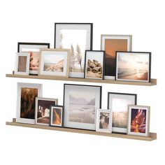 multiple frames are arranged on a shelf with pictures and photos hanging from it's sides