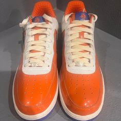 Before The 2006 World Cup In Brazil, Nike Released An Air Force 1 Capsule Dedicated To Five Nike-Sponsored Countries Competing In The Tournament. These Air Force 1 Premium ‘Netherlands' Are Finished In A Patent Leather And Feature A Vermilion Orange Outer With A White Upper And A Cobalt Blue Swoosh, Representing The Dutch National Team Jersey Colors. Replacing The Nike Tongue Tag Is A Stitched Royal Dutch Football Association Logo, Which Is Also Stamped On The Inner Sole. The Blue Rubber Outsole Custom Orange Leather Sneakers With Laces, Orange Leather Custom Sneakers, Nike Custom Orange Sneakers With Laces, Orange Nike Custom Sneakers With Laces, 2006 World Cup, Association Logo, Sneaker Cleaner, Sit Out, Nike Air Force 1 Low