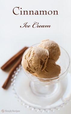 two scoops of cinnamon ice cream in a glass bowl