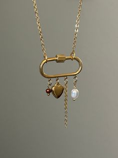 The Carabiner Charm Necklace 🤍 18k gold plated stainless steel at the length of your choice! (If you don't see your desired length in the drop down menu, send me a message. I am always happy to customize!)  ✨lobster clasp and extender added for adjustability!  featuring a freshwater pearl, crystal bead, gold drop chain, and a mini heart pendant!  Hypoallergenic & tarnish resistant 😊 Made with love 🫶 Yellow Gold Necklaces With Hook And Links For Gift, Elegant Gold Necklaces With Carabiner Clasp, Gold Chain Link Necklace With Carabiner Clasp, Gold-tone Jewelry As A Gift With Hook And Links, Carabiner Charm Necklace, Necklaces Aesthetic, Chain Necklace Gold, Gold Charms, Link Chain Necklace