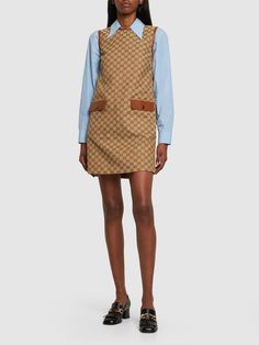 Find GUCCI Gg Cotton Blend Canvas Dress on Editorialist. Concealed back zip closure. Logo details. All over pattern placement may vary. Leather trim. Two front pockets. Unlined. Model is wearing a size38 Canvas Dress, Gucci Dress, Versace Brand, All Over Pattern, Cotton Blends Dress, Jacquard Dress, Tweed Dress, Blue Midi Dress, Shearling Jacket