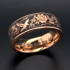 Add something unique and elegant to your jewelry collection. This wedding ring is crafted from rose gold plated tungsten carbbide with deluxe rounded comfort fit interior. The ring features a beautiful design with ravens & roses. Raven is a spirit bird. When you need spiritual rebirth, listen to her warnings respectfully. She is there to protect and guide. The ring is true to size and having your finger size properly measured before ordering is must. It is heavy enough to be felt and pretty enou Luxury Classic Engraved Ring For Ceremonial Use, Mens Fairy Wedding Ring, Cheap Black Engraved Rings, Luxury Handmade Mystical Rings, Supernatural Wedding Rings, Ornate Luxury Engraved Ring For Ceremonies, Engagement Rings For Men For Him Rose Gold, Luxury Black Heirloom Engraved Ring, Luxury Medieval Style Rings As Gift