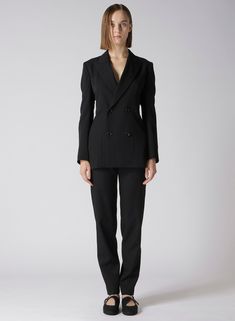 An exquisite wool gabardine jacket characterized by a beautifully tailored waistline. The slightly tight design accentuates the waist, while the supple fabric highlights the elegant drapery, particularly in the back. This piece combines material texture and sophisticated design for an overall elegant appearance. - Wool gabardine material with elegant drapery - Slightly tight waistline design - Highlights the back's beautiful silhouette - Model wears sample item; actual size and texture may vary Chic Fitted Suit With Concealed Placket, Elegant Office Pantsuit With Structured Boning, Elegant Double-breasted Pantsuit, Sleek Suits With Structured Boning For Work, Elegant Business Pantsuit With Structured Boning, Elegant Tailored Double Breasted Suit For Fall, Elegant Structured Pantsuit For Office Wear, Evening Tailored Double Breasted Suit With Pressed Crease, Tailored Double Breasted Suit With Hidden Buttons For Evening