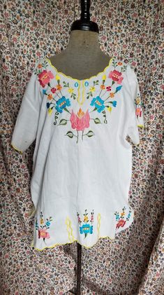 "Fantastic one of a kind looks to be hand made vintage floral embroidered scalloped edge top! No tag please pay close attention to the measurements Measurements are as follows: Shoulder to shoulder 17\" Chest 42\" length - 26\" Hip 42\" Sleeve length 6.5\" Feel free to make us an offer- don't be shy! International shipping please contact us prior to purchase" White Embroidered Short Sleeve Top, Retro Short Sleeve Top With Floral Embroidery, Fitted Short Sleeve Embroidered Top, Fitted Short Sleeve Top With Embroidered Hem, Vintage Embroidered Short Sleeve Tops, Spring Multicolor Embroidery Short Sleeve Tops, Floral Print Short Sleeve Embroidered Top For Spring, Retro Short Sleeve Blouse With Floral Embroidery, Spring Embroidered Short Sleeve Fitted Top