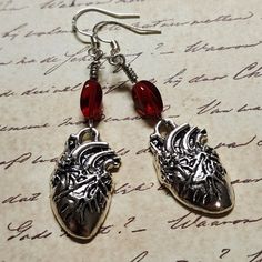 Anatomical Heart Dangle Earrings with Red Glass Bead.  Dangle approx 2.25".  Hypo-allergenic sterling silver ear wires. Anatomical Heart, Heart Dangle Earrings, Red Glass, Lebanon, Glass Bead, Ear Wires, Jewelry Earrings Dangle, Glass Beads, Dangle Drop Earrings