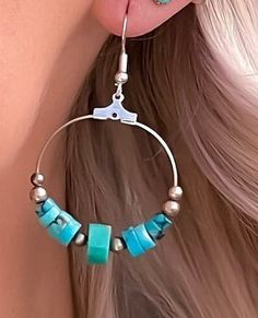 Turquoise hoop earrings in sterling silver. These turquoise bead earrings feature hand carved turquoise stone beads as well as sterling silver beads making these round drop earrings very special! These turquoise earrings have a boho feeling and also make a fine addition to your Western jewelry collection. This turquoise is top quality and makes a stunning compliment to your favorite outfit. Because these are natural turquoise stones, there is slight variations in each stone, which adds to the be Beaded Circle Jewelry For Gifts, Beaded Circular Jewelry Gift, Beaded Turquoise Metal Jewelry, Turquoise Beaded Dangle Jewelry, Turquoise Beaded Metal Jewelry, Southwestern Style Beaded Dangle Jewelry, Handmade Blue Hoop Jewelry, Nickel-free Sterling Silver Round Bead Jewelry, Nickel-free Blue Small Hoop Jewelry