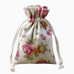 a white bag with pink flowers on it