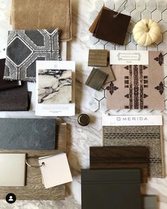 various materials are laid out on the floor for making decorative wall tiles and rugs