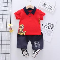 Toddler Boy Polo T-shirt & Shorts Wholesale Children's Clothing - PrettyKid Red Playwear Sets For Summer, Red Summer Playwear Sets, Red T-shirt For Summer Playwear, Red Summer Playwear T-shirt, Red Cartoon Print Tops For Playwear, Red Cotton Sets With Cartoon Print, Red Cartoon Print Sets For Playtime, Red Casual Playtime Sets, Wash Label