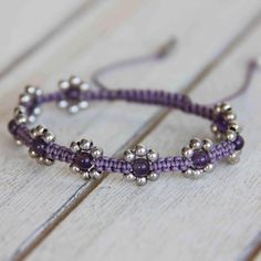 Amethyst Flower Bracelet – MYONO JEWELRY Hand-strung Silver Amethyst Jewelry, Bohemian Silver Amethyst Crystal Bracelet, Purple Flower Shaped Beaded Bracelets, Purple Flower-shaped Beaded Bracelets, Amethyst Beaded Bracelets With Spacer Beads As Gift, Adjustable Purple Beaded Bracelet With Silver Beads, Purple Beaded Flower Bracelets, Handmade Spiritual Flower Beaded Bracelets, Handmade Adjustable Lavender Crystal Bracelet