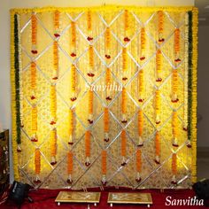 the backdrop is decorated with orange and yellow flowers