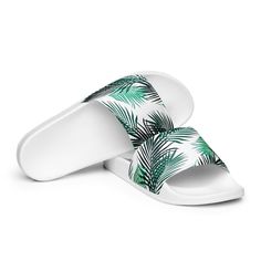 A must-have for the summer: these women’s slides. A pair of these will keep you comfy throughout your day of beach or pool activities, thanks to the cushioned upper strap and the textured footbed. • Cushioned and durable faux leather upper strap • Lightweight polyurethane (PU) outsole • Contoured, textured footbed • Stitched around the upper perimeter for extra durability • Spot clean only • Printed, cut, and handmade • Blank product sourced from China Important: This product is available in the White Tropical Flip Flops For Vacation, Tropical White Flip Flops For Vacation, Casual Synthetic Flip Flops For Vacation, Tropical White Vacation Flip Flops, Synthetic Slide Flip Flops With Textured Footbed, White Beach Slippers With Textured Footbed, White Synthetic Sandals For Pool, White Slide Flip Flops For Swimming, White Synthetic Sandals For The Pool