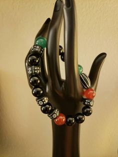 This beautiful stretch bracelet is made with multi colored glass beads. And is accompanied by a terra cotta black and white oval bead and several small black and white rounds. It is 7 1/2 inches and made for easy wear. Casual Black Beads Stretch Bracelet Gift, Bohemian Black Stretch Bracelet As A Gift, Casual Black Beads Stretch Bracelet, Bohemian Black Stretch Bracelet As Gift, Unique Black Beaded Bracelets With Colorful Beads, Casual Black Beaded Bracelet With Large Beads, Casual Black Beaded Bracelets With Large Beads, Unique Black Beaded Bracelet, Casual Multicolor Bracelets With Polished Beads