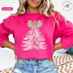 Get festive with our Dalmatian Bow Pink Christmas Tree Sweatshirt for women, featuring a coquette style perfect for the holiday season! This adorable and trendy design combines the charm of a pink Christmas tree with a playful Dalmatian bow, adding a touch of feminine flair to your winter wardrobe. Cozy, cute, and stylish, it's the perfect choice for anyone who loves to celebrate Christmas in a unique and fashionable way! Available also in Tshirt 👉🏻 KEY PRODUCT UNISEX SWEATSHIRT: GILDAN 18000 .: Medium-heavy fabric. .: Loose fit .: Sewn-in label .: Runs true to size, remember to go up 2 sizes than your regular to get the oversize effect!! SIZING CHART UNISEX Adult S, S, M, L, XL, XXL and 3XL are available Remember to go up 2 sizes than your regular to get the oversize effect!! CARE DIREC Family Sweaters, A Pink Christmas, Family Sweater, Coquette Christmas, Pink Tree, Coquette Style, Pink Christmas Tree, Pink Trees, Xmas Sweater