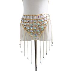 Introducing the Glam Tassel Chain Set - a dazzling and trendy two-piece outfit designed for fashion-forward women. This set is perfect for festivals, parties, or any occasion where you want to stand out in style. Featuring a stunning chain crop top, this set is adorned with crystal sequins and handmade patchwork for a unique and eye-catching look. The metal tassel chains add a touch of glamour and movement, creating a mesmerizing effect as you dance the night away. Crafted with attention to deta Bohemian Body Jewelry With Chain Strap, Bohemian Waist Chain With Chain Strap For Party, Summer Festival Metal Body Jewelry, Gold Chain Belt For Summer Festival, Metal Body Chain For Summer Festivals, Bohemian Body Chain With Chain Strap For Festivals, Bohemian Body Jewelry With Chain Strap For Festivals, Summer Festival Metal Body Chain, Glamorous Gold Body Chain For Festivals