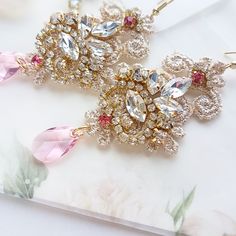 Chandelier statement wedding earrings. Hand embroidered with rhinestone on Venice lace, topped with lovely crystals. Earrings are very light and comfortable to wear, you can order matching bracelet and hair pins (separately). You can as well order earrings in other rhinestone crystals. This earrings will be shipped nicely packed in the gift box. For other wedding jewelry visit my shop; https://www.etsy.com/shop/byPiLLowDesign Order Earrings, Boho Wedding Earrings, Wedding Earrings Chandelier, Pink Crystal Earrings, Statement Earrings Wedding, Crystals Earrings, Bridal Earrings Chandelier, Hippie Earrings, Gold And Pink