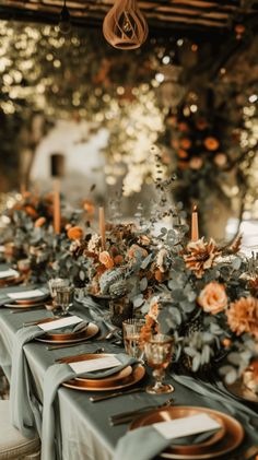 a long table set with plates and place settings