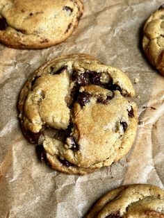 several chocolate chip cookies on top of wax paper