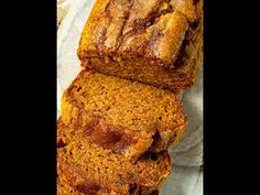 sliced loaf of pumpkin bread sitting on top of a table