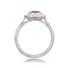 A 1.55ct ruby with deep blue saturation rests in the center of a handcrafted platinum ring. The ring showcases a halo of diamonds and openwork filigree under the gallery. ✦ WHAT COMES IN THE PACKAGE: - Diamond Engagement Ring - Quality Ring Box - Jewelry Cleaner ✦ WHY SHOP WITH US: - We've been in business for 40+ years - All of our rings are handcrafted and include high-quality natural diamonds - We offer 14-Days full refund returns - FREE insured overnight shipping (and FREE Return Shipping) - Luxury Oval Ruby Diamond Ring, Oval Cabochon Ruby And Diamond Ring, Gia Certified Platinum Ruby Ring, Gia Certified Fine Jewelry Ruby Ring In Platinum, Gia Certified Oval Ruby Ring, Gia Certified Platinum Ruby Ring In Fine Jewelry, Luxury Platinum Ruby Ring With Center Stone, Luxury Ruby Ring With Platinum Center Stone, Luxury Oval Diamond Ring With Lab-created Ruby