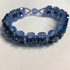 a bracelet with blue glass beads on it