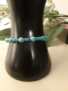 Beautiful Turquoise Bracelet- 6 mm turquoise round semi precious gemstone paired with 4 mm turquoise faceted Rondelle semi precious gemstones with antique brass accent beads and completed with antique brass lobster claw clasp Sizing options available from 6 inches to 8.5 inches Makes a wonderful gift - for more great gift ideas https://sequoiajewelz.etsy.com Adjustable Turquoise Hand-strung Beaded Bracelets, Hand-strung Turquoise Crystal Round Bracelet, Turquoise Silver Bracelet, Hand-strung Turquoise Jade Bracelets, Elegant Turquoise Multi-stone Bracelets, Southwestern Turquoise Multi-stone Bracelets, Gemstone Beaded Bracelets, Healing Jewelry, Glass Bracelet