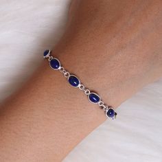 "Lapis Lazuli Bracelet, 925 Solid Sterling Silver Bracelet, Handmade Bracelet, September Birthstone, Women Silver Jewelry, Hippie Bracelet Gemstone Name - Lapis Lazuli Stone Quality - AAA Bracelet Weight - 5.60  gm Stone Length - 0.6 cm  Stone Width - 0.3 cm  Length - 6 inch to 9 inch sizes are available, we give 0.5 inch adjustable in the size which you order ( NOTE - 0.5 INCH ADJUSTABLE IS INCLUDED IN YOUR ORDERED SIZE ) Stone Shape - As shown in the picture You'll get the exact product as sho Women Jewelry Silver, Sapphire Sterling Silver Bracelet, Dainty Sterling Silver Bracelets With Natural Stones, Sterling Silver Crystal Bracelet With Natural Stones, Sapphire Sterling Silver Bracelets Gift, Sapphire Sterling Silver Bracelet Gift, Sapphire Sterling Silver Bracelet For Gift, Elegant Blue Sterling Silver Bracelet Stamped 925, Elegant Blue Sterling Silver Bracelet