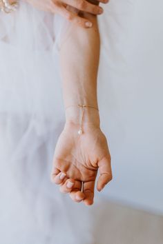 Beautiful dainty bracelet with delicate freshwater pearl center. 925 silver with 18k gold plating 925 silver with Rhodium plating Length is approximately 16cm READY TO SHIP - Ships in 1 to 3 business days Dainty Pearl Bracelet With Pendant As Gift, Delicate Pearl Pendant Bracelet As Gift, Pearl Bracelet With Pearl Drop, Minimalist Pearl Jewelry With Oyster Bracelet, Pearl Drop Bracelet Jewelry, Dainty Pearl Chain Bracelet, Delicate Adjustable Charm Bracelet, Adjustable Pearl Bracelet With Pearl Pendant For Wedding, Adjustable Pearl Bracelet With Pearl Pendant