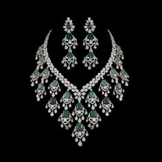 Emerald Necklace Set inspired by Sabyasachi, features a stunning green emerald paired with sparkling American diamonds and cubic zirconia.  Perfect for Indian weddings or special occasions, this statement piece adds a touch of elegance and luxury. An ideal gift for brides, it's a beautiful addition to any jewelry collection. *𝐏𝐑𝐎𝐃𝐔𝐂𝐓 𝐃𝐄𝐓𝐀𝐈𝐋* * 𝐌𝐚𝐭𝐞𝐫𝐢𝐚𝐥: Brass * 𝐏𝐥𝐚𝐭𝐢𝐧𝐠: White Rhodium Plated * 𝐒𝐭𝐨𝐧𝐞: AAA-quality CZ Diamond & Emerald. *𝐃𝐈𝐌𝐄𝐍𝐒𝐈𝐎𝐍𝐒* *𝐍𝐞𝐜 Arzano Jewellery, Real Diamond Necklace, Diamond Pendants Designs, American Diamond Necklaces, Diamond Pendant Sets, Diamond Necklace Designs, Bridal Diamond Jewellery, Diamond Necklace Set, Diamond Jewelry Necklace