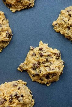 chocolate chip cookies are arranged on a baking sheet