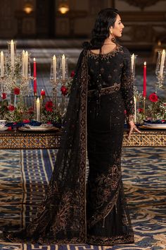 Elegant Pakistani Wedding Dress in Classic Black Shade Net Saree features handcrafted adda embellishments, thread embroidery, and sequins, hanging drapes and cut-out details on the sleeves, and handcrafted tassels on the back. Detailed Description: SKU: WB418 Detailing: Embroidery, Motifs, Naqshi, Sequins, Tilla Color: Black Fabric: Net, Tissue, Cotton Silk Design: Fully Embellished Dress with Embroidery, Goldwork Event: Bridal wear, Wedding Embroidery Goldwork, Hanging Drapes, Wedding Dresses Pakistani, Silk Design, Desi Wedding Dresses, Pakistani Wedding Outfits, Pakistani Wedding Dress, Saree Models, Net Saree