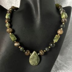 New Handmade Necklace Is Made With Green Serpentine Rectangle Beads, Round Agate Brown Beads, Green And Coral Round Unakite Beads, A Large Russian Serpentine Teardrop Focal Bead, And A Silver-Plated Hook And Eye Clasp With An Extender. This Necklace Measures 17" Long, And The Extender Measures 2-1/2" Long. This Necklace Has A Vintage Boho Retro Look. * This Is A One-Of-A-Kind Necklace. * There May Be Some Color Discrepancies Due To Different Monitor Settings. The Colors Are Described As Clearly Earthy Boho Jewelry, Green Wood Bead Necklace, Big Beaded Jewelry, Thick Beaded Necklace, Earth Tone Necklace, Earthy Beaded Jewelry, Czech Bead Necklace, Brown Bead Necklace, Vintage Jewelry Necklaces