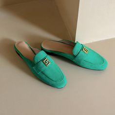 Green mules are totally unique. With suede upper and classic loafer style. these flat mules are stylish and will be amazing if you pair them with white pants. Upper: Suede Lining: Genuine Leather Outsole: Rubber Toe: Round Toe Closure: Slip on Color: Green. Beige is_handmade: Yes Elegant Green Slip-on Mules, Spring Office Slip-on Mules, Office Slip-on Mules With Flat Heel, Summer Slip-on Office Loafers, Chic Green Mules For Formal Occasions, Summer Workwear Flat Slip-ons, Chic Mules For Workwear With Round Toe, Classic Suede Mules For Spring, Chic Slip-on Flat Slippers