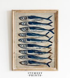 an image of fish in a frame on the wall