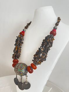 This necklace is a perfect gift for someone who truly loves and appreciates beautiful gemstones. I can only say that it is a beautiful piece of jewelry that will really make you stand out from the crowd. This necklace is made of huge beads. * Antique Moroccan Berber Necklace Handmade with coins, the necklace features an intricate pattern in its texture, a beautiful Berber piece of jewelry that radiates Moroccan Berber history and cultural significance, each handcrafted by artisans qualified from Handmade Necklaces For Rituals And Festivals, Bohemian Pendant Jewelry For Rituals, Bohemian Beaded Necklaces With Round Pendant, Bohemian Beaded Necklace With Round Pendant, Bohemian Pendant Necklaces For Rituals, Bohemian Handmade Beaded Pendant Necklaces, Handmade Bohemian Beaded Pendant Necklaces, Bohemian Beaded Necklace With Polished Round Beads, Artisan Necklaces For Festivals