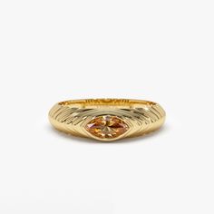 This 14k Gold step beveled ring features a radiant 7x3.5 MM marquise cut Citrine, the birthstone for November. The ring has a modern design, perfect for everyday wear, and the Citrine gemstone adds a pop of color to the piece. The step beveled design adds depth to the ring and the 14k Gold gives it a touch of luxury. This ring is perfect for anyone born in November or anyone who loves the color yellow. Features: * Made to Order * Gold Kt: 14K Solid Gold (also available in 18K) * Available Gold Colors: Rose Gold, Yellow Gold, White Gold * Marquise Citrine: 1 pc 7 x 3.5 MM * Citrine Carat Weight: 0.35 ctw * Ready to Ship in 7-10 Business days  ▶ See more of our Gemstone Jewelry here- https://etsy.me/3CGRdMI ▶ See our storefront here - http://etsy.me/2lUcVnH  ▶ All store sections here * Diamo Luxury Faceted Yellow Gold Rings, November Birth Stone Rings, Luxury Gold Marquise Signet Ring, Beveled Ring, Citrine Ring Engagement, November Birthstone Ring, Slouch Socks, Marquise Ring, Gold Armband