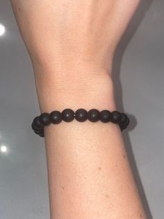 The bracelet is made with 8mm matte black beads and stretch cord. The standard size for the bracelets is 6.75 inches. You can request custom sizes in the notes! These bracelets are perfect for stacking or wearing alone! They make great gifts for bridal showers, baby showers, bridesmaids, Mother's Day, sorority sisters, bachelorette parties, birthdays, hospital gifts for new mamas, etc. Since each bracelet is custom made, all sales are final and no refunds will be issued. Please be sure to check Elegant Adjustable Matte Black Jewelry, Elegant Matte Black Adjustable Jewelry, Adjustable Black Wristband With 8mm Beads, Adjustable Black Wristband With Round Beads, Classic Adjustable Black Bead Bracelets, Classic Black Beaded Bracelets For Everyday, Classic Adjustable Black Bead Bracelet, Classic Adjustable Black Beads Bracelet, Classic Adjustable Black Beaded Bracelets