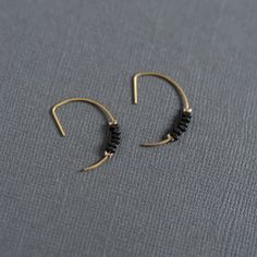 Artist earrings -matte black – Wild Roots Creative Modern Black Small Hoop Jewelry, Everyday Metal Cartilage Earrings With Ear Wire, Modern Black Hoop Jewelry, Minimalist Handmade Black Earrings, Black Hoop Earrings For Everyday, Black Everyday Hoop Earrings, Black Edgy Dangle Earrings, Edgy Black Dangle Earrings, Everyday Black Hoop Earrings