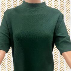 * Flattering short sleeve top perfect for work or jeans.  *A deep green for fall or subtle team spirit!  *Would be perfect with gold jewelry, could be worn tucked in or left out. * The textured fabric is wrinkle free and professional ! Green Short Sleeve T-shirt For Work, Green Short Sleeve Tops For Fall, Green Fitted Short Sleeve Casual Top, Fitted Green Short Sleeve Top, Casual Fitted Green Short Sleeve Top, Fitted Green Short Sleeve Casual Top, Green Short Sleeve Top For Work, Green Crew Neck T-shirt For Work, Green Stretch Blouse For Work