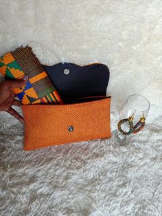 **African çlutch bags,African print bag,African leather purses, women purses.***They are made out of kente  and jute material***They are fabulous way to bring taste to any outfit.**Comes with a matching wallet.and earrings.. ***Perfect christmas gift for her***For wholesale kindly message us.Ship via dhl express.Thank you for stopping by. Orange Bags With Removable Pouch For Gifts, Brown Handheld Clutch As Gift, Brown Handheld Clutch As A Gift, Orange Clutch Bag As A Gift, Orange Clutch Bag For Gift, Rectangular Orange Pouch For Gifts, Orange Rectangular Pouch For Gift, Brown Pouch Clutch As Gift, Orange Handheld Bag For Gift