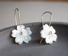 "Beautiful and elegant flower earrings. Perfect bridal pair of earrings. These earrings feature hand-carved white mother of pearl shell, creating sweet flowers. These flowers then made into small threader earrings in your choice of metal: sterling silver, 14k gold-filled, or rose gold filled. These pair of earrings are a perfect everyday piece of jewelry that is also perfect for any special occasion. Earrings measure at 1 1/2\" long 3,5 cm Flowers are 20 mm long and wide. PACKAGING -Your purchas Handmade Elegant Flower Pendant Earrings, Petal-shaped Earrings With 3d Flowers As Gift, Petal-shaped 3d Flower Earrings For Gift, White Nickel-free Flower Earrings For Anniversary, 3d Petal Shaped Flower Earrings, Delicate Handmade Petal Earrings, White Petal-shaped Earrings For Gift, Dainty White Pierced Flower Earrings, Elegant White Flower Pendant Earrings