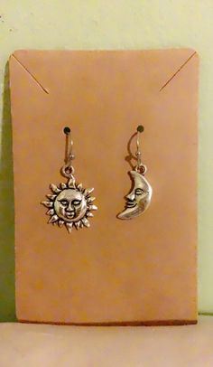 the sun and moon earrings are on display