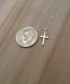 Similar items: ALLDANAE.etsy.com Please read my shop policies before ordering: https://www.etsy.com/shop/AllDanae#policies A small, simple cross necklace in all .925 sterling silver materials. Not including the loop, the cross measures approximately 3/8 inch high, and 1/4 inch wide (about 9mm X 6mm). The cross is small and understated, yet solid and very study. The smooth, unadorned silver goes effortlessly with whatever you are wearing. Your necklace can be made long or short. Choose your prefe Everyday Silver Crucifix Jewelry, Silver Crucifix Jewelry For Everyday Wear, Minimalist Hypoallergenic Cross Jewelry, Dainty Silver Crucifix Jewelry, Everyday Silver Cross Pendant Necklace, Hypoallergenic Cross Jewelry For Everyday, Simple Everyday Cross Pendant Necklace, Silver Crucifix Cross Necklace For Everyday, Minimalist Silver Cross Necklace