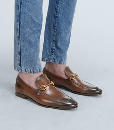 Timeless Gucci Loafers With Leather Sole, Gucci Timeless Leather Sole Loafers, Timeless Gucci Slip-on Loafers, Timeless Gucci Loafers, Brown Gucci Slip-on Loafers, Gucci Calf Leather Loafers With Horsebit Detail, Luxury Leather Loafers With Horsebit Detail, Luxury Brown Gucci Loafers, Gucci Leather Tassel Loafers Slip-on