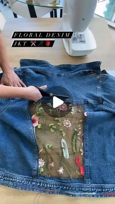 someone is cutting through the back of a pair of jeans